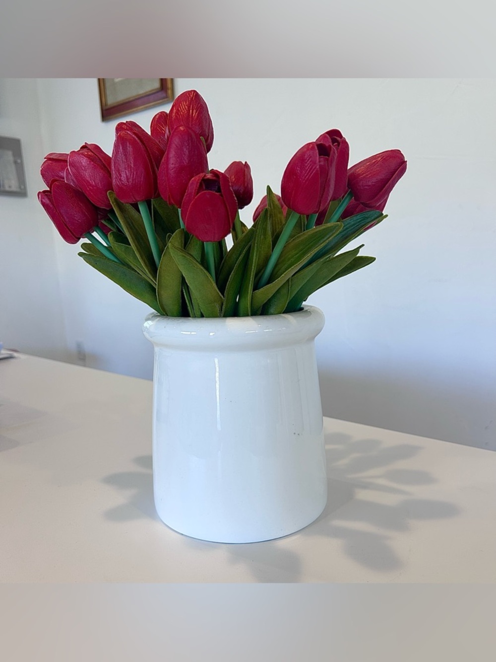 White Ceramic Vase with Red Tulip Arrangement